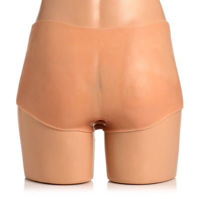 Back view of light silicone panty-shorts with an anal opening designed for gender-affirming wear.