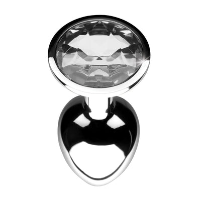 Small clear gem anal plug with smooth tapered metal body and faceted crystal base in polished silver finish.