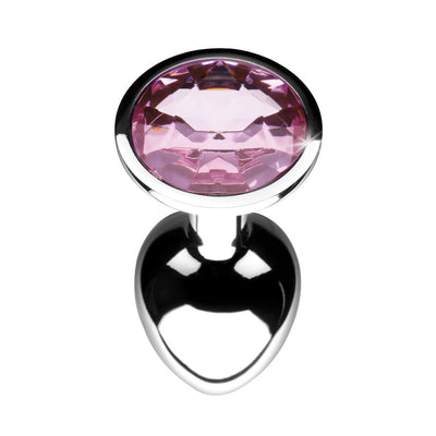 Small silver metal anal plug with a smooth tapered shape and a sparkling pink gem at the base.