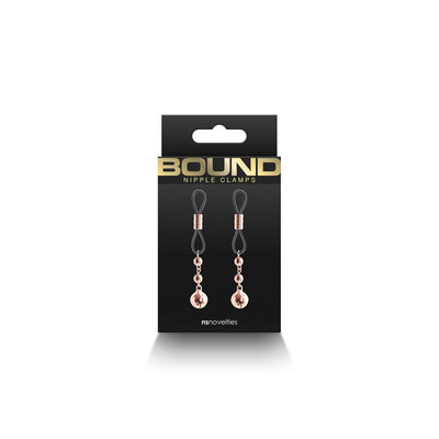 Rose gold adjustable Bound D1 nipple clamps with silicone tips displayed on black packaging.