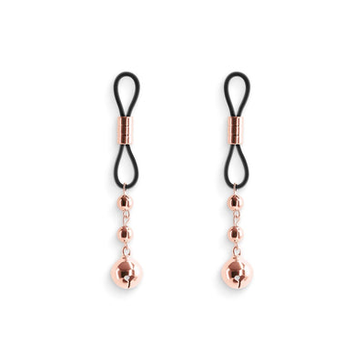 Pair of rose gold adjustable nipple clamps with black silicone loops and dangling decorative beads on white background.