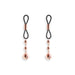 Pair of rose gold adjustable nipple clamps with black silicone loops and dangling decorative beads on white background.