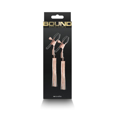 Rose gold adjustable nipple clamps with black silicone tips and decorative tassels in black packaging.