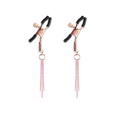 Pair of rose gold adjustable nipple clamps with black silicone tips and pink decorative chains.