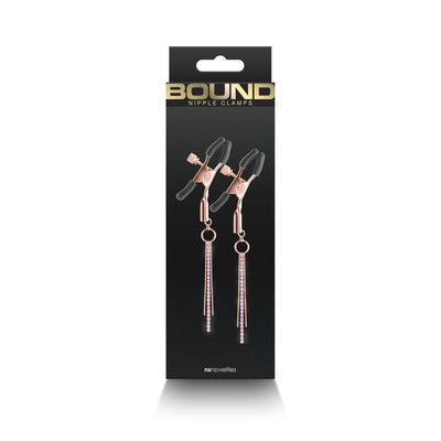 Rose gold adjustable nipple clamps with black silicone tips and pink rhinestone chain accents in black packaging.