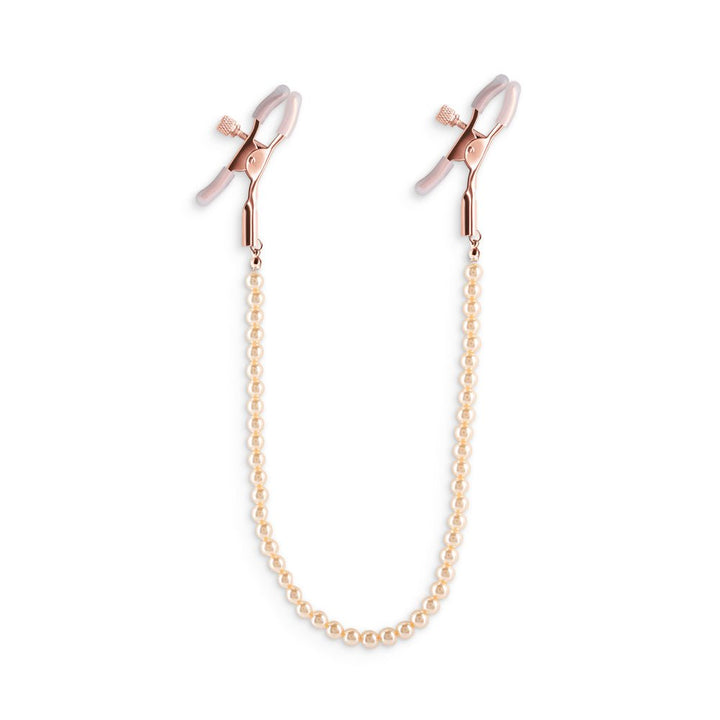 Rose gold adjustable nipple clamps with soft silicone tips connected by a delicate pearl chain for stylish sensation play.