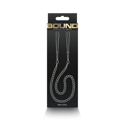 Bound DC3 adjustable nipple clamps with chain, featuring black silicone tips on a sleek metal design in retail packaging.