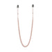 Rose gold adjustable nipple clamps connected by a matching chain with black silicone tips for comfort.