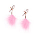Rose gold adjustable nipple clamps with soft silicone tips and attached pink feather accents on a white background.