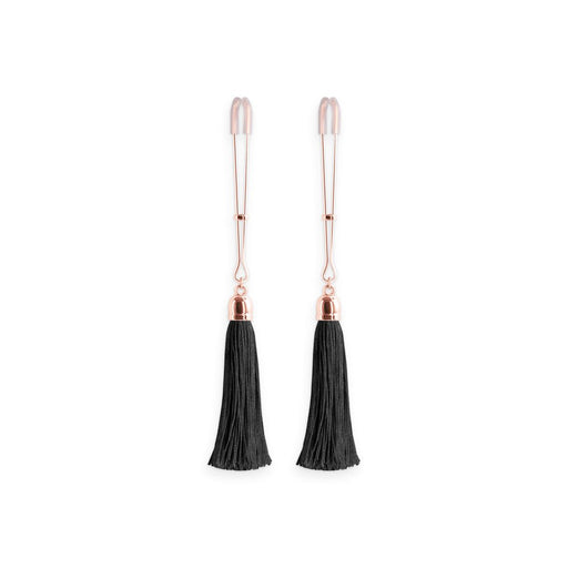 Pair of rose gold adjustable nipple clamps with soft silicone tips and black tassel accents on a white background.