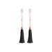 Pair of rose gold adjustable nipple clamps with soft silicone tips and black tassel accents on a white background.