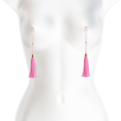 Rose gold adjustable nipple clamps with soft silicone tips and pink tassel accents displayed on a white mannequin torso.