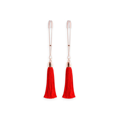 Pair of rose gold adjustable nipple clamps with soft silicone tips and vibrant red tassels on a white background.