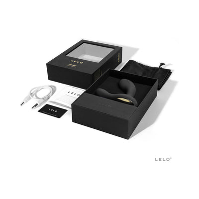 LELO Bruno prostate vibrator in black with packaging, charging cable, user manual, and storage pouch displayed on white background.