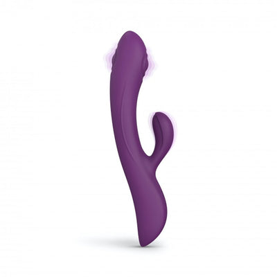 Purple ergonomic dual stimulator with curved design and separate clitoral arm, shown upright on white background.