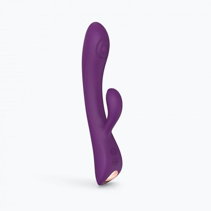 Purple dual stimulator with curved shaft and smaller external arm, ergonomic design with control buttons at base.