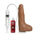 Realistic brown dildo with suction base, syringe pump, and bottle of Nut Butter lubricant for squirting effect.