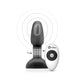 Compact black vibrating rimming plug with rotating beads and a white wireless remote control.