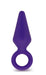 Small indigo silicone anal plug with tapered tip and safety ring for secure, comfortable use.