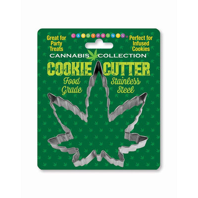 Stainless steel cannabis leaf-shaped cookie cutter on green packaging labeled food grade and perfect for party treats and infused cookies.