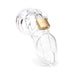 Clear medical-grade polycarbonate male chastity device with brass padlock on white background
