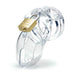 Clear male chastity device with brass padlock, designed for comfort and secure fit with vented cage and locking pins.