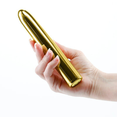 Hand holding a sleek, gold-colored 7-inch rechargeable vibrator with a smooth, polished finish.