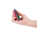 Hand holding a sleek, multi-color metallic Chroma Petite Bullet vibrator with pink painted nails.