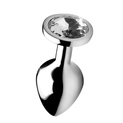 Medium-sized polished metal anal plug with clear faceted gem at the base on a white background.