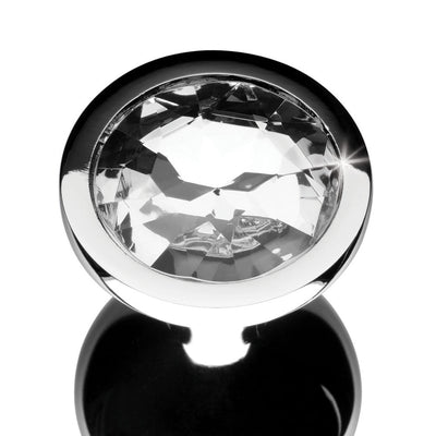 Medium-sized clear gem anal plug with a polished silver metal finish and faceted crystal jewel base.