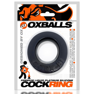 Black Cock-B Bulge cockring made of soft silicone in branded Oxballs packaging with bold orange and black design.