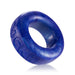 Blue glittery silicone cock ring with embossed lettering, smooth and stretchy for comfortable wear.