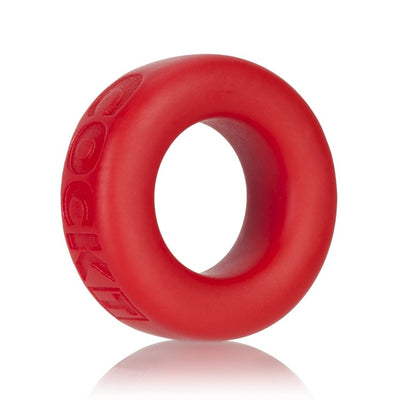 Red silicone cock ring with embossed branding, smooth texture, and a flexible, rounded design.