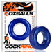 Blue premium silicone cock ring with a smooth, stretchy design displayed alongside its branded Oxballs packaging.
