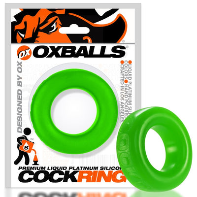 Bright green silicone cock ring with smooth texture, displayed in branded OXBALLS packaging.