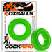 Bright green silicone cock ring with smooth texture, displayed in branded OXBALLS packaging.