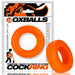 Orange premium silicone cock ring with packaging featuring bold black and orange branding by Oxballs.