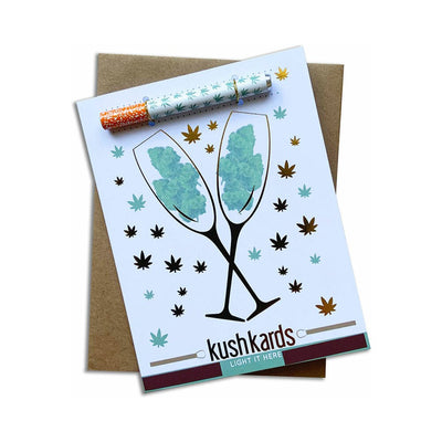 Congrats Champagne-themed cannabis greeting card with metal one-hitter pipe and decorative leaf accents on white background.