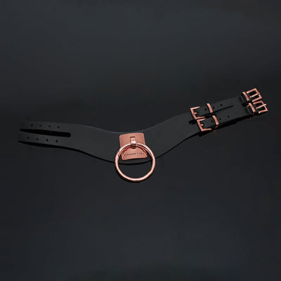 Black vegan leather collar with rose gold metal ring, engraved Coquette plate, and adjustable double buckle closures.