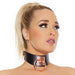 Woman wearing a black vegan leather collar with rose gold metal ring and engraved Coquette plate, styled with a high ponytail.