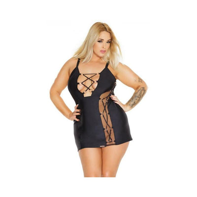 Plus size model wearing a black Coquette Pleasure Collection dress with adjustable straps and lace-up sheer side panels.