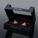 Coquette Pleasure Collection rose gold metal pasties in black velvet-lined display box with clear lid and ribbon loop.