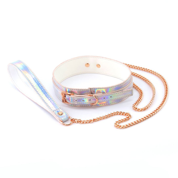 Rainbow holographic bondage collar with rose gold chain leash and buckle on white background.