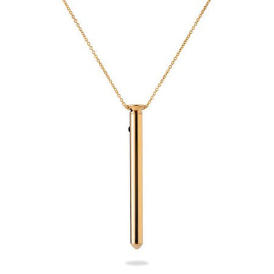 Sleek gold-tone stainless steel pendant necklace with a slender, cylindrical design and delicate chain.