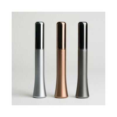 Three sleek, metallic Crave Wink Plus vibrators in silver, rose gold, and gun metal finishes standing upright on a neutral background.