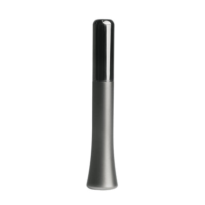 Sleek gun metal vibrator with a smooth, ergonomic design and glossy black cap, compact and discreet for travel.