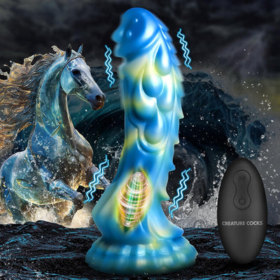 Blue and yellow iridescent sea stallion-themed dildo with textured shaft and remote control against a stormy ocean background.