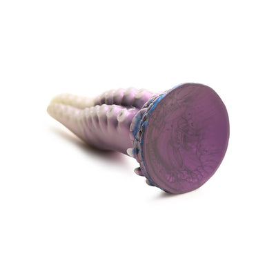 Pearl white, purple, and blue silicone tentacle-shaped dildo with textured suckers and wide suction cup base.