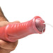 Close-up of a peach and black centaur-themed dildo with a flexible shaft and syringe tube injecting fluid from the tip.