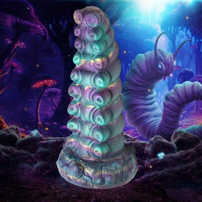 Iridescent teal and purple fantasy caterpillar-inspired silicone toy with textured segments and suction cup base.